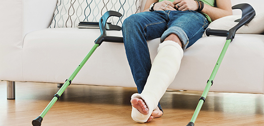 Man with broken leg at home