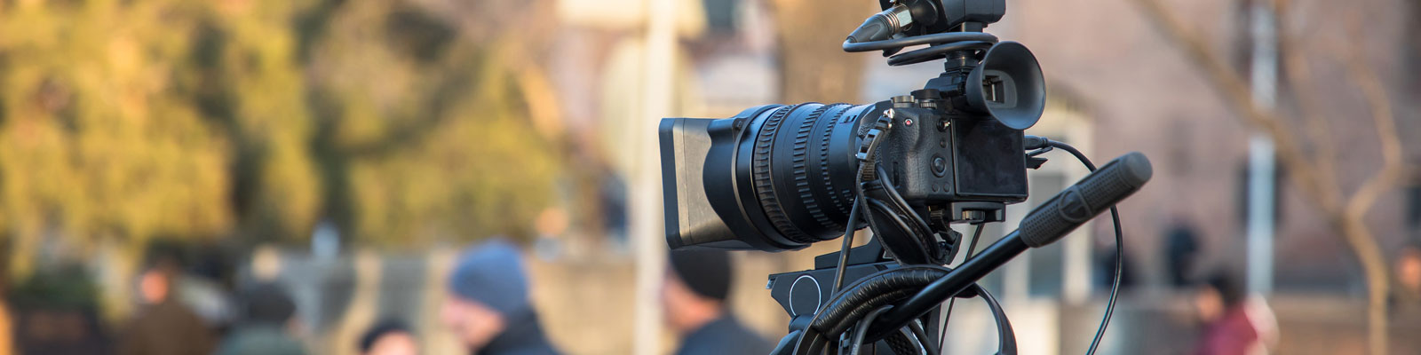 Video camera set up on a street for filming.